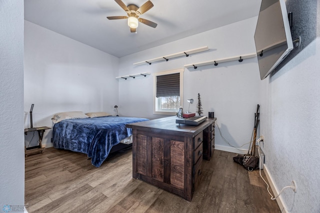 bedroom with ceiling fan and wood-type flooring