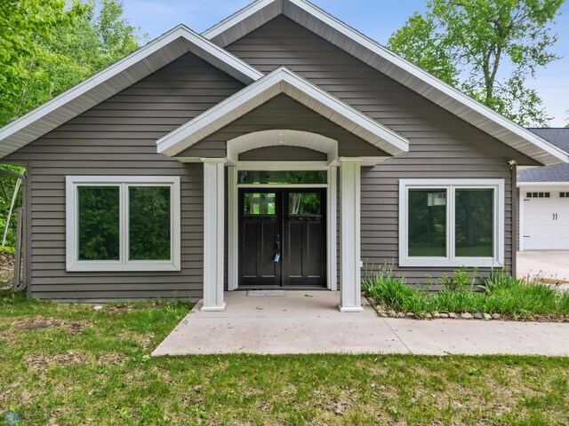 25379 Deerpath Loop, Pelican Rapids, MN 56572 - entrance to property featuring an attached garage and a yard