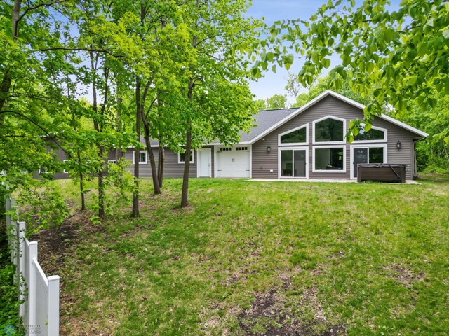 25379 Deerpath Loop, Pelican Rapids, MN 56572 - back of house with a hot tub and an attached garage