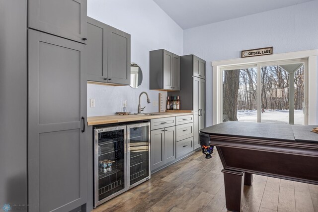 25379 Deerpath Loop, Pelican Rapids, MN 56572 - indoor wet bar with beverage cooler and wood-type flooring