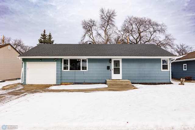 single story home featuring a garage