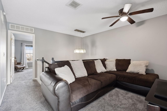 living room with light carpet and ceiling fan