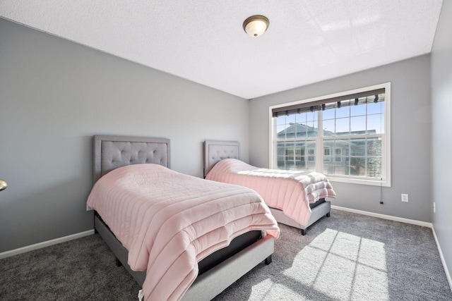 carpeted bedroom featuring a textured ceiling