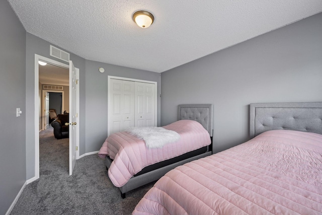 7316 Bunker Lake Blvd NW, Ramsey, MN 55303 - bedroom featuring carpet, a closet, a textured ceiling, and baseboards