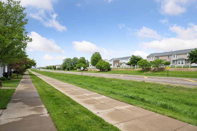 7316 Bunker Lake Blvd NW, Ramsey, MN 55303 - view of asphalt road featuring sidewalks and traffic signs