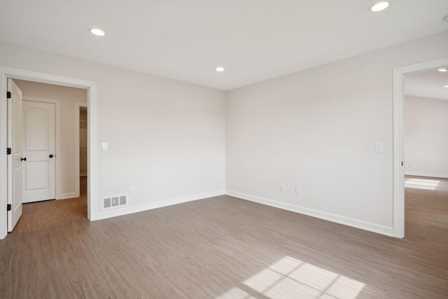 spare room with hardwood / wood-style flooring