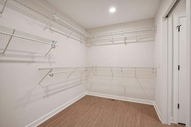 walk in closet featuring hardwood / wood-style floors