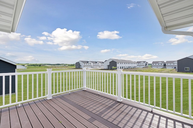 wooden deck with a yard