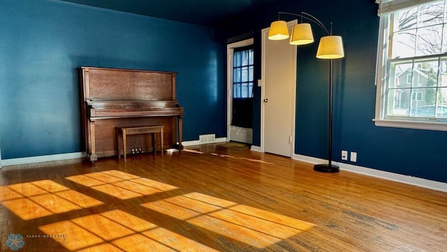 miscellaneous room with hardwood / wood-style floors