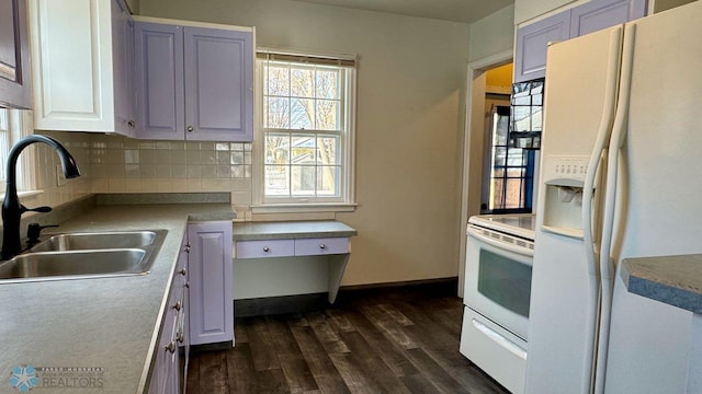 kitchen with white cabinetry, sink, white appliances, and backsplash