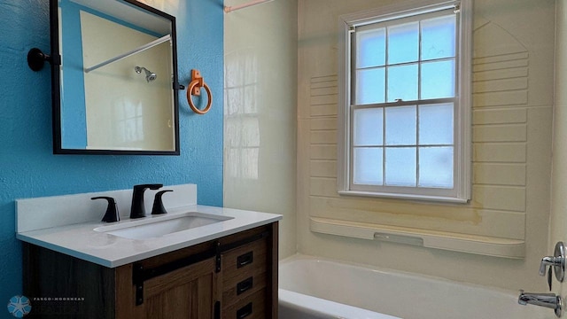 bathroom with vanity and shower / tub combination