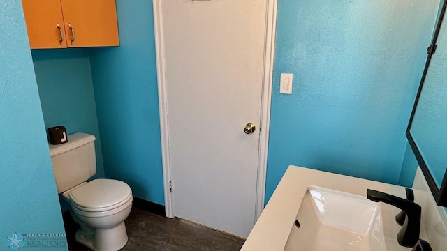 bathroom featuring sink and toilet