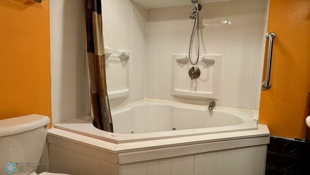 bathroom with shower / tub combo and toilet