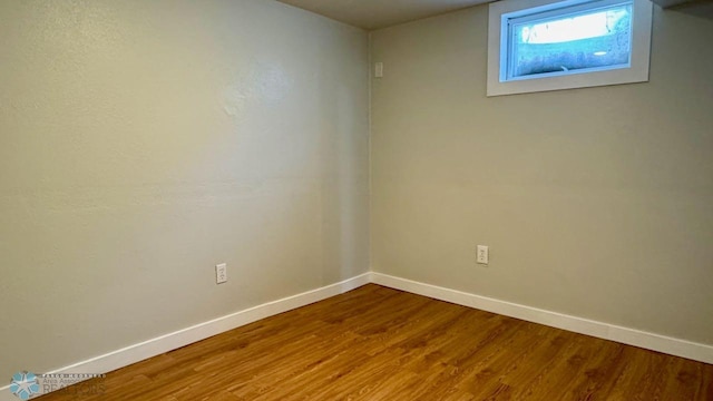 unfurnished room featuring hardwood / wood-style floors