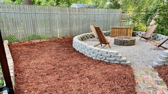 view of yard with a patio and a fire pit