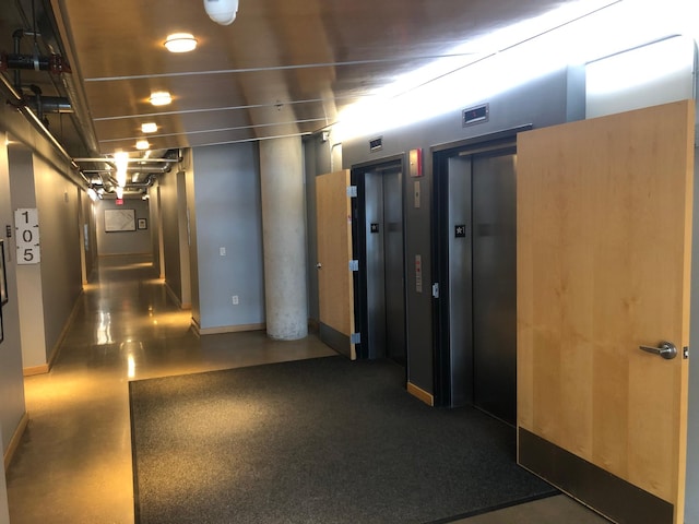 hallway featuring elevator