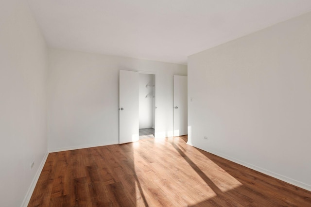 spare room featuring hardwood / wood-style floors