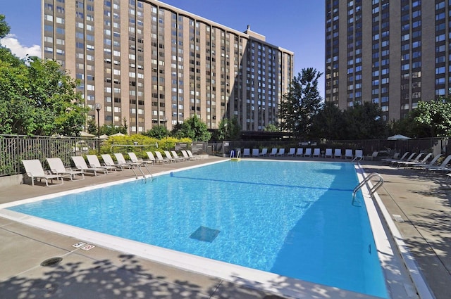 view of swimming pool featuring a patio area