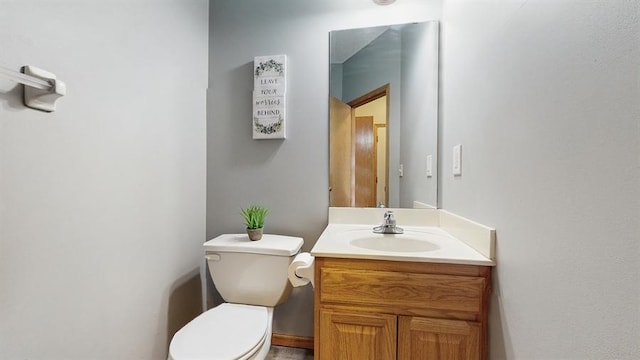 half bath with toilet and vanity