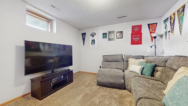 carpeted living area featuring visible vents, a textured ceiling, and baseboards