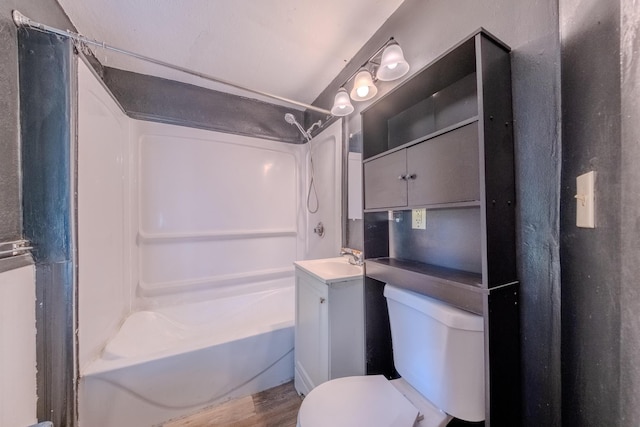 full bathroom with vanity, hardwood / wood-style flooring, toilet, and shower / bath combination