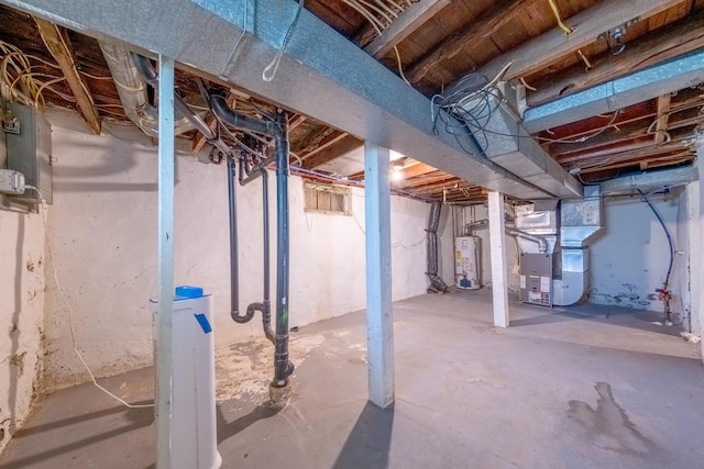 basement with water heater and heating unit