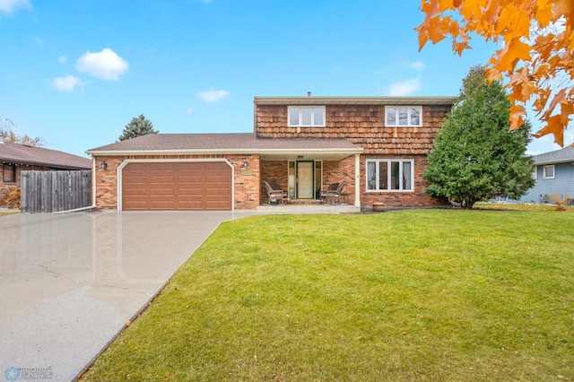 front facade featuring a garage and a front yard