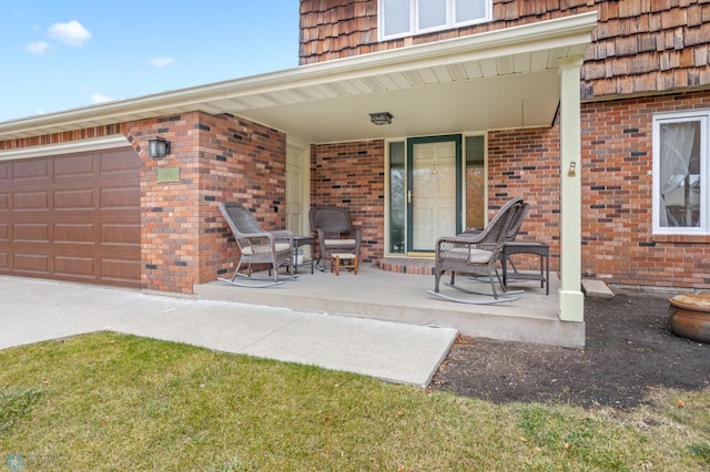 view of patio with a garage and covered porch