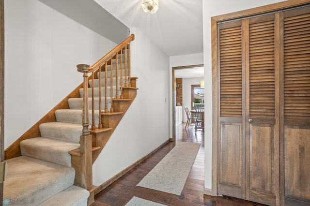 staircase featuring hardwood / wood-style floors