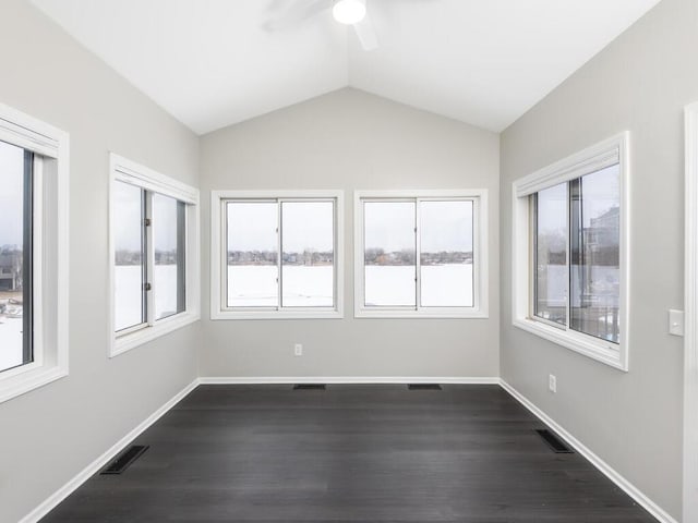 unfurnished sunroom with vaulted ceiling, a healthy amount of sunlight, and ceiling fan