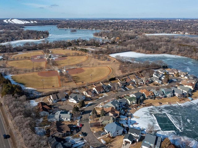 birds eye view of property with a water view