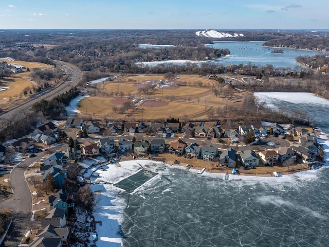 birds eye view of property with a water view