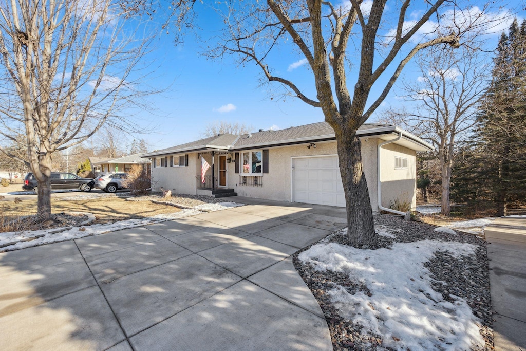 ranch-style home featuring a garage