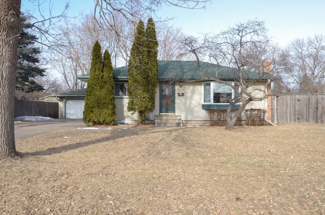 single story home with a garage