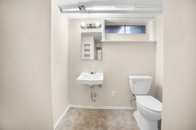 bathroom featuring sink and toilet