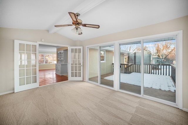 carpeted spare room featuring french doors, ceiling fan, and lofted ceiling with beams