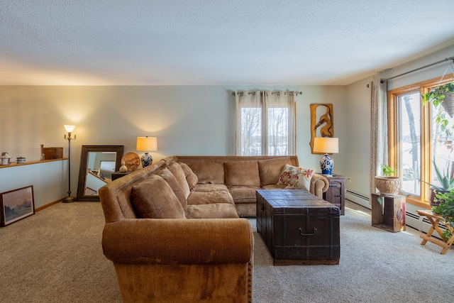 living room with light colored carpet, a textured ceiling, and baseboard heating