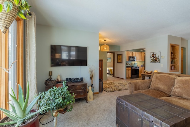 living room with baseboards and light colored carpet