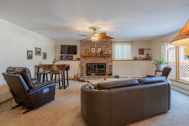 living room with a brick fireplace, carpet, baseboards, and ceiling fan