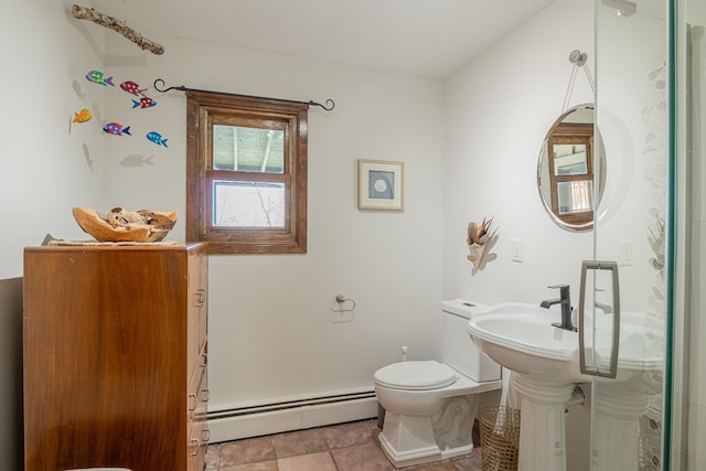 bathroom with a baseboard heating unit and toilet