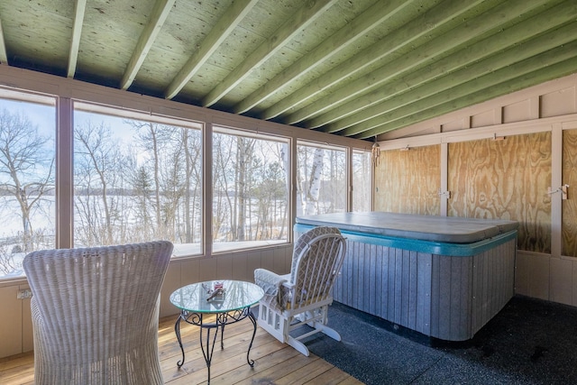 sunroom / solarium featuring lofted ceiling