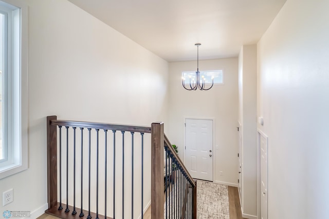 foyer with a chandelier and light hardwood / wood-style flooring