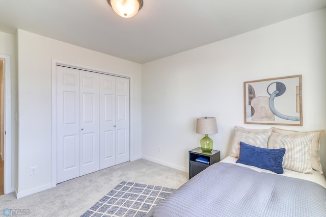 bedroom featuring light carpet and a closet