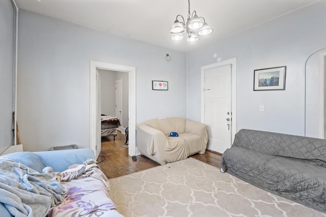 living room featuring hardwood / wood-style floors and a notable chandelier