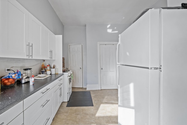 kitchen with white cabinetry and white appliances