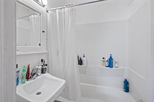 bathroom featuring sink and shower / bath combo with shower curtain