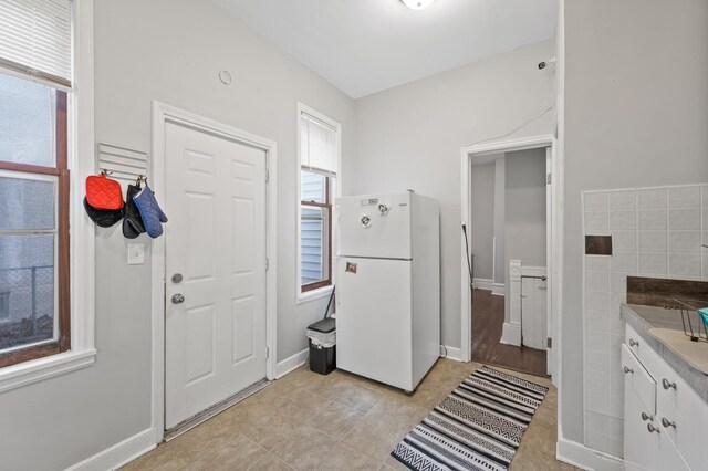 entryway featuring tile walls