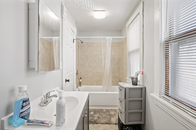 bathroom with vanity and shower / bathtub combination with curtain