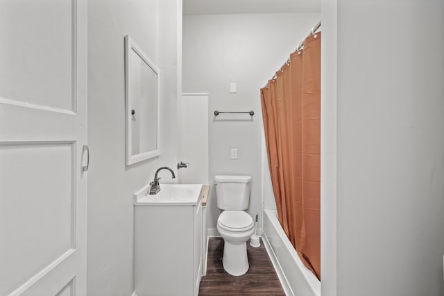 full bathroom featuring vanity, hardwood / wood-style flooring, toilet, and shower / bath combo