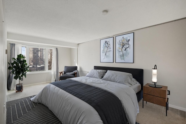 bedroom with carpet flooring and a textured ceiling